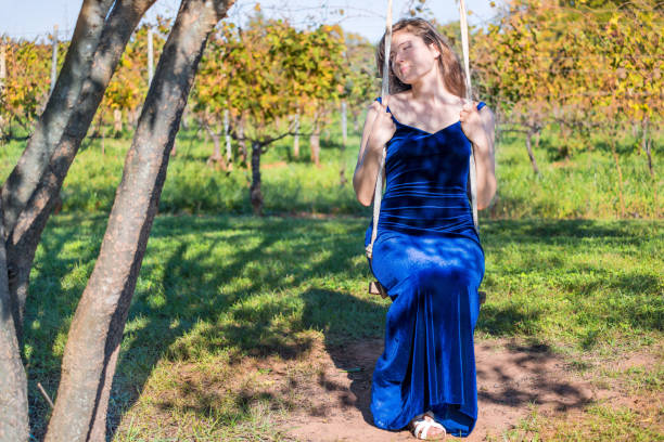 Fashionable cobalt blue dress with nude pumps